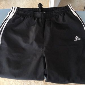 Adidas Women’s track pants with zippered ankles.